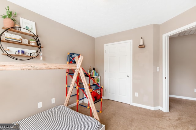 carpeted bedroom with baseboards
