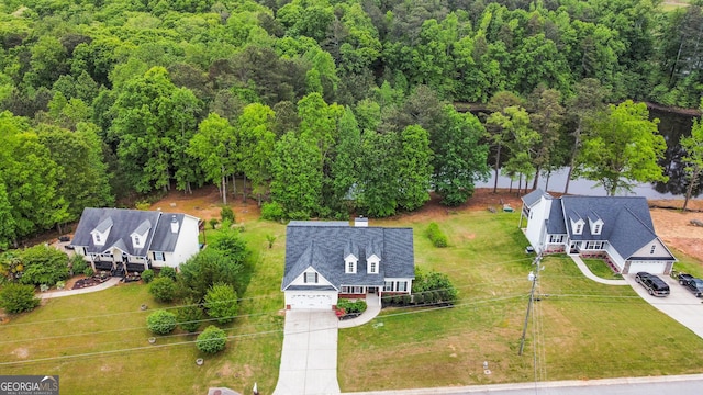 drone / aerial view featuring a view of trees