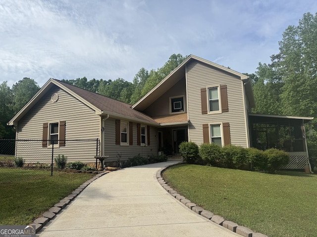 1685 Bailey Creek Rd SW, Conyers, GA 30094 - traditional home with fence, a sunroom, and a front lawn