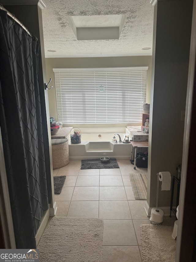 1685 Bailey Creek Rd SW, Conyers, GA 30094 - full bath featuring a bath, tile patterned floors, and a textured ceiling