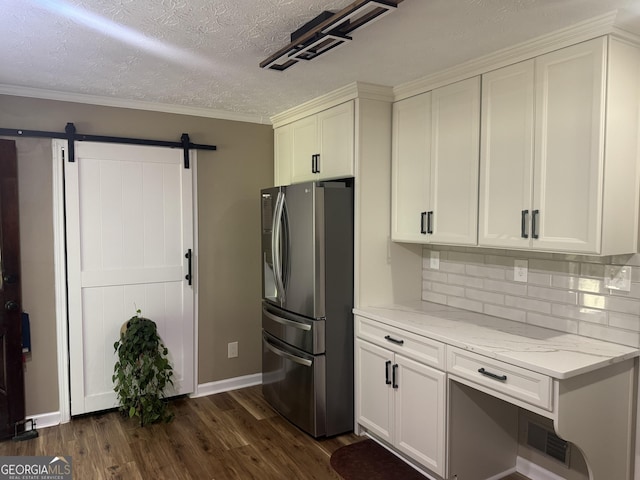 1685 Bailey Creek Rd SW, Conyers, GA 30094 - kitchen featuring light stone countertops, baseboards, dark wood-style floors, white cabinets, and stainless steel fridge with ice dispenser