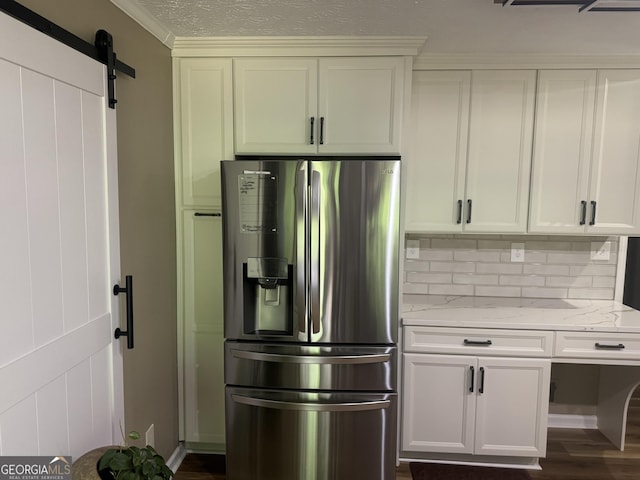 1685 Bailey Creek Rd SW, Conyers, GA 30094 - kitchen with stainless steel fridge with ice dispenser, light stone countertops, dark wood-style floors, a barn door, and tasteful backsplash