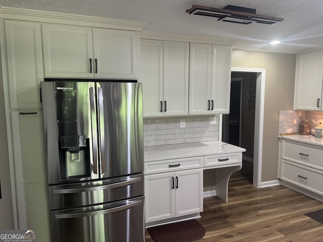 1685 Bailey Creek Rd SW, Conyers, GA 30094 - kitchen featuring dark wood-style flooring, stainless steel fridge, white cabinets, light stone counters, and backsplash