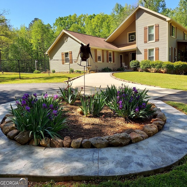 1685 Bailey Creek Rd SW, Conyers, GA 30094 - view of front facade featuring fence, driveway, and a front yard