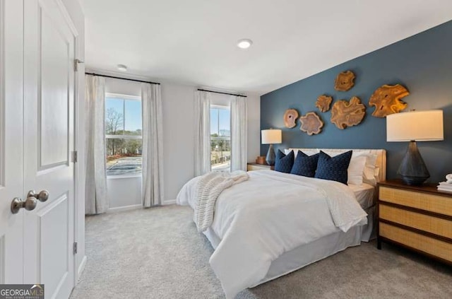 bedroom with baseboards and carpet floors