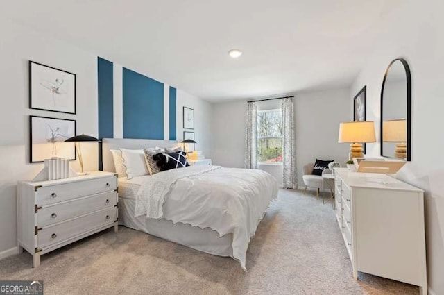 bedroom featuring light colored carpet