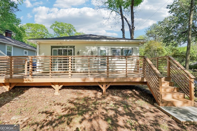back of property with a deck