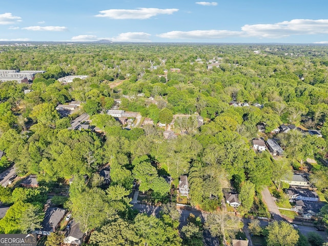 birds eye view of property with a forest view