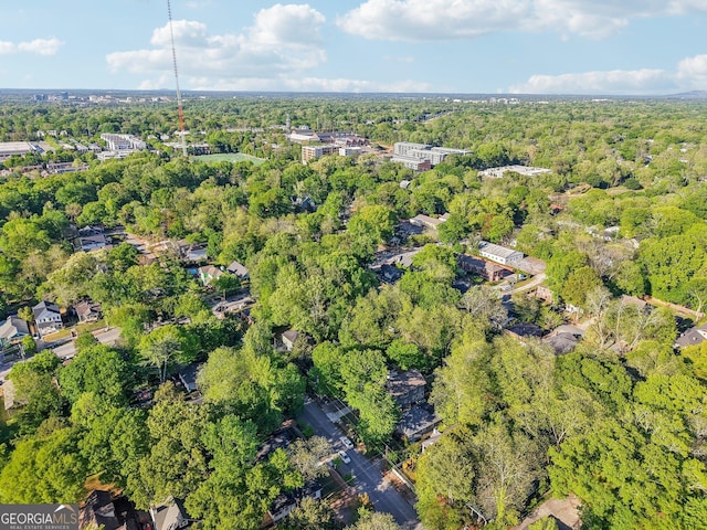 drone / aerial view featuring a view of trees