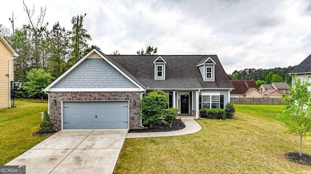 view of front facade with driveway, a front lawn, brick siding, and a garage