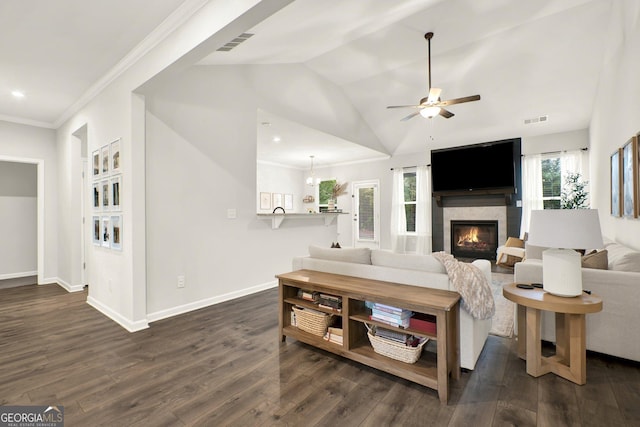 living area featuring visible vents, ceiling fan, baseboards, a glass covered fireplace, and dark wood finished floors