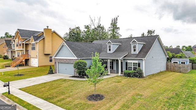 view of front of property with concrete driveway, a front yard, an attached garage, and fence