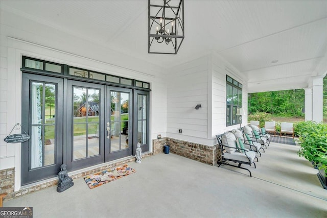 205 River Forest Dr, Forsyth, GA 31029 - view of patio / terrace featuring french doors and a porch