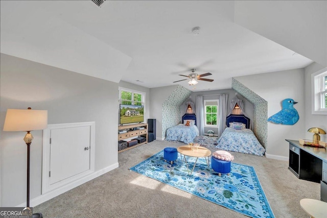 205 River Forest Dr, Forsyth, GA 31029 - interior space featuring baseboards, multiple windows, carpet, and a ceiling fan