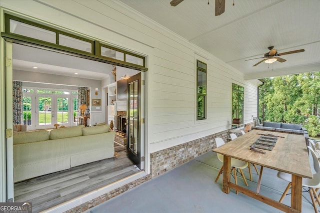 205 River Forest Dr, Forsyth, GA 31029 - view of patio featuring french doors, a ceiling fan, outdoor dining space, and an outdoor hangout area