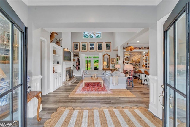 205 River Forest Dr, Forsyth, GA 31029 - foyer featuring a brick fireplace and wood finished floors