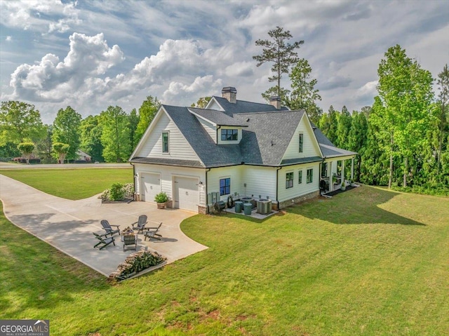 205 River Forest Dr, Forsyth, GA 31029 - rear view of property featuring an outdoor fire pit, a chimney, central air condition unit, a patio, and a yard