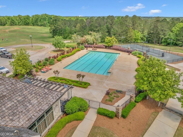 205 River Forest Dr, Forsyth, GA 31029 - pool with a view of trees, a patio area, and fence