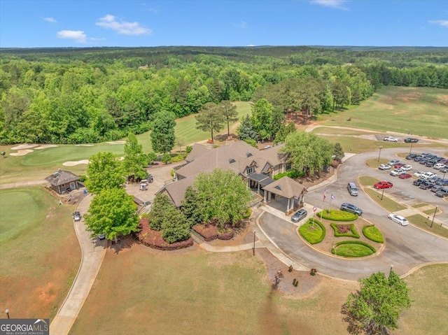 205 River Forest Dr, Forsyth, GA 31029 - birds eye view of property featuring golf course view and a wooded view