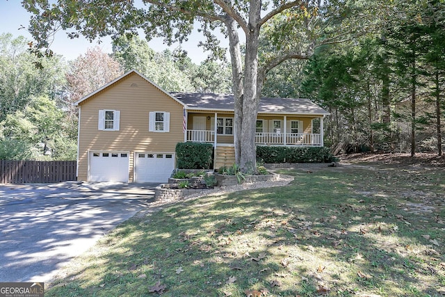 304 N Briar Rdg, Woodstock, GA 30189 - ranch-style house featuring covered porch, fence, an attached garage, and driveway