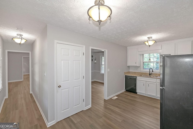 304 N Briar Rdg, Woodstock, GA 30189 - kitchen with white cabinetry, a sink, black appliances, and wood finished floors