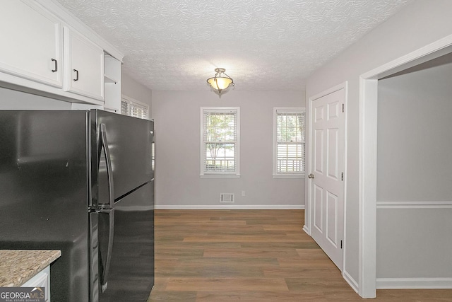 304 N Briar Rdg, Woodstock, GA 30189 - kitchen featuring white cabinets, a textured ceiling, freestanding refrigerator, visible vents, and dark wood-style floors