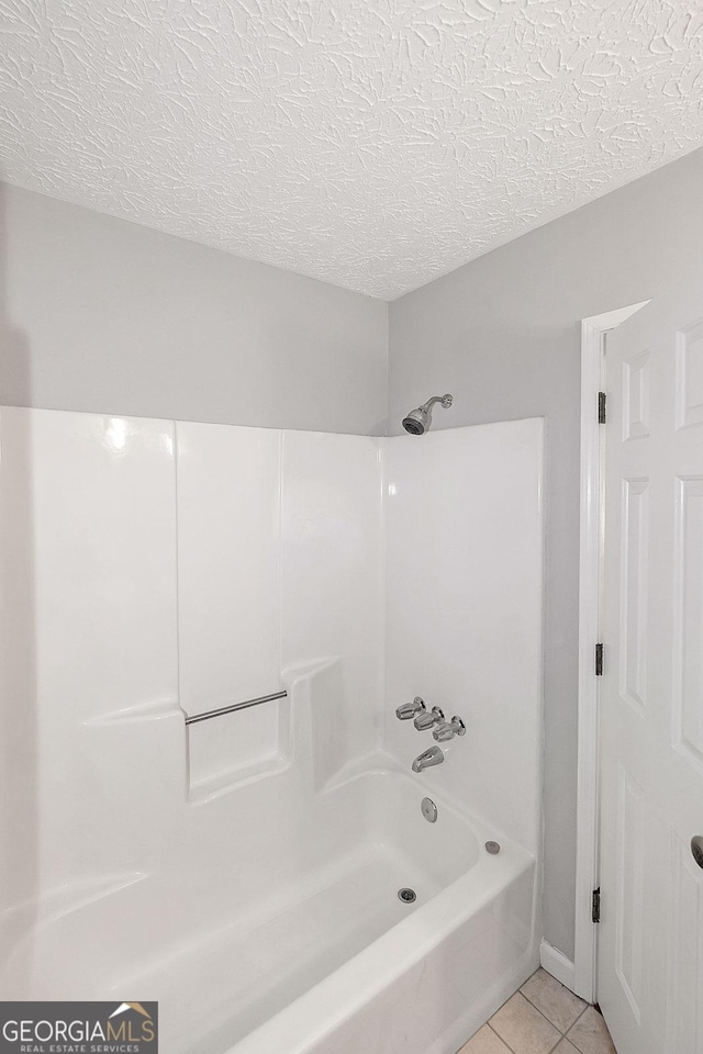 304 N Briar Rdg, Woodstock, GA 30189 - full bathroom featuring a textured ceiling, shower / bathing tub combination, and tile patterned floors