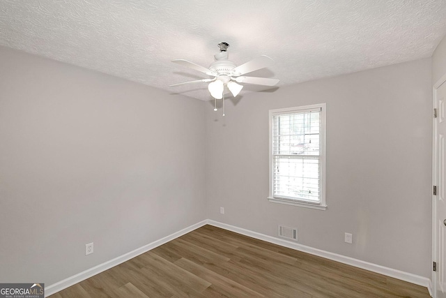 304 N Briar Rdg, Woodstock, GA 30189 - spare room with baseboards, a ceiling fan, wood finished floors, and visible vents