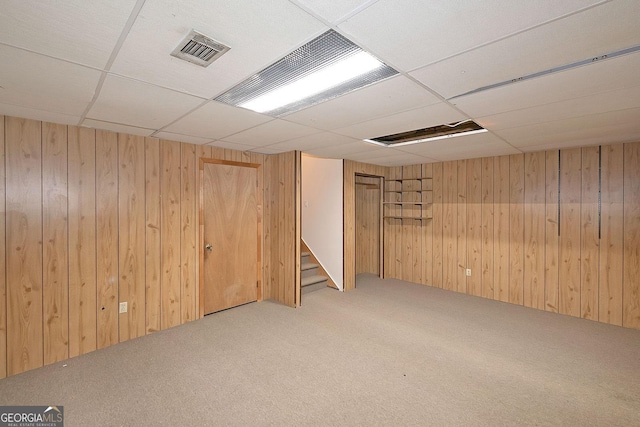 304 N Briar Rdg, Woodstock, GA 30189 - finished basement with visible vents, stairway, carpet floors, wooden walls, and a drop ceiling