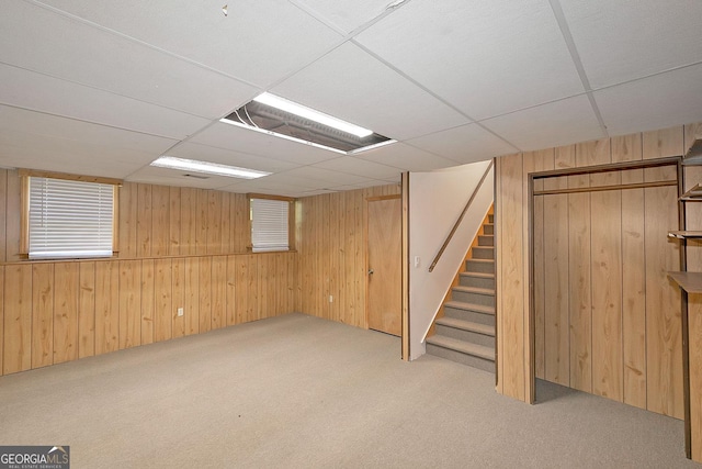 304 N Briar Rdg, Woodstock, GA 30189 - finished below grade area featuring carpet, wood walls, a paneled ceiling, and stairs