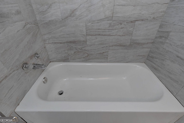 full bath with a tub to relax in