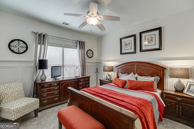 2930 Aquitania Ln, Cumming, GA 30040 - bedroom with a decorative wall, a wainscoted wall, and light carpet