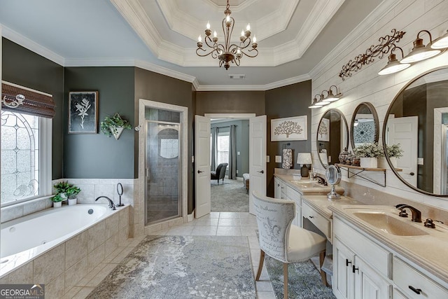 2930 Aquitania Ln, Cumming, GA 30040 - bathroom with an inviting chandelier, a shower stall, a sink, a garden tub, and a tray ceiling