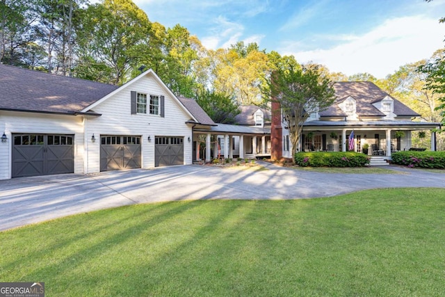 3380 Hill Forest Trl NW, Acworth, GA 30101 - view of front of home with a garage, covered porch, a front yard, roof with shingles, and concrete driveway