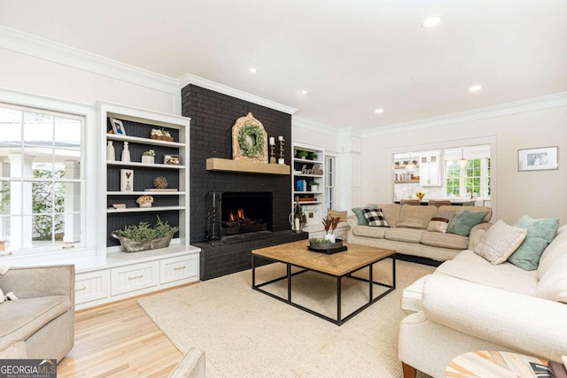 3380 Hill Forest Trl NW, Acworth, GA 30101 - living room featuring crown molding, recessed lighting, light wood-style flooring, and a fireplace