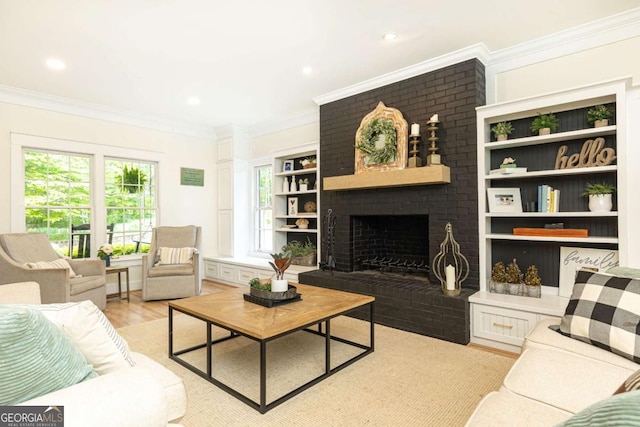3380 Hill Forest Trl NW, Acworth, GA 30101 - living room with a fireplace, built in shelves, ornamental molding, recessed lighting, and light wood-style flooring