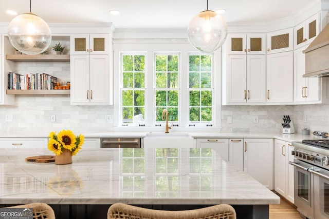 3380 Hill Forest Trl NW, Acworth, GA 30101 - kitchen with appliances with stainless steel finishes, a sink, white cabinets, custom exhaust hood, and ornamental molding