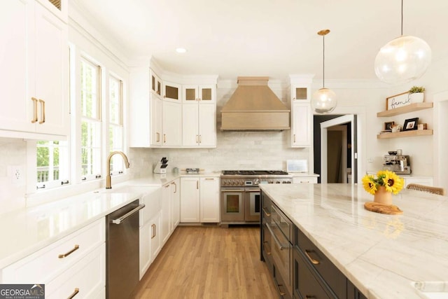 3380 Hill Forest Trl NW, Acworth, GA 30101 - kitchen with light stone countertops, appliances with stainless steel finishes, white cabinetry, tasteful backsplash, and custom exhaust hood