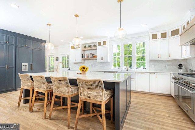 3380 Hill Forest Trl NW, Acworth, GA 30101 - kitchen featuring decorative backsplash, white cabinetry, and range with two ovens