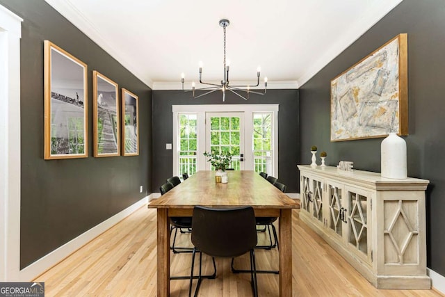 3380 Hill Forest Trl NW, Acworth, GA 30101 - dining area with light wood-type flooring, baseboards, crown molding, and a chandelier
