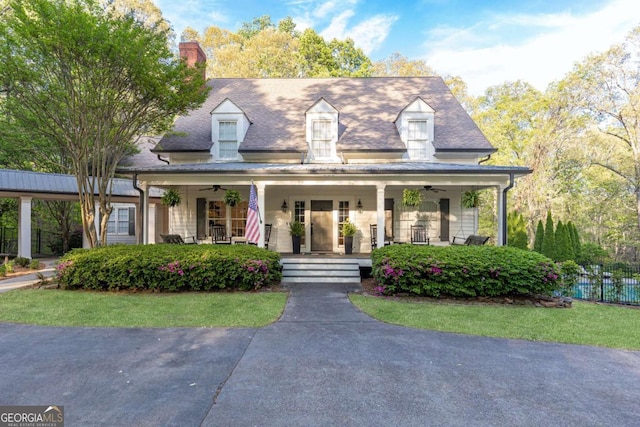 3380 Hill Forest Trl NW, Acworth, GA 30101 - cape cod house featuring a porch, ceiling fan, fence, and a chimney
