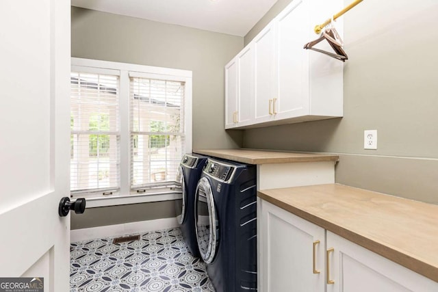 3380 Hill Forest Trl NW, Acworth, GA 30101 - laundry area featuring cabinet space, independent washer and dryer, baseboards, and light tile patterned floors