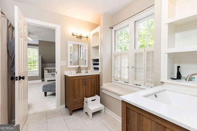 3380 Hill Forest Trl NW, Acworth, GA 30101 - bathroom featuring baseboards, ceiling fan, a wealth of natural light, and vanity
