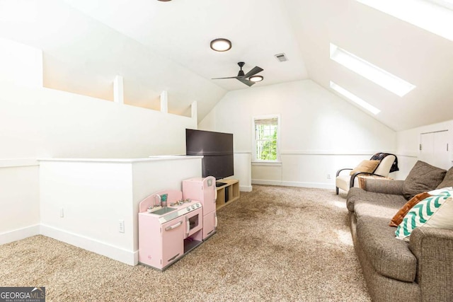 3380 Hill Forest Trl NW, Acworth, GA 30101 - interior space featuring visible vents, ceiling fan, vaulted ceiling with skylight, and light carpet