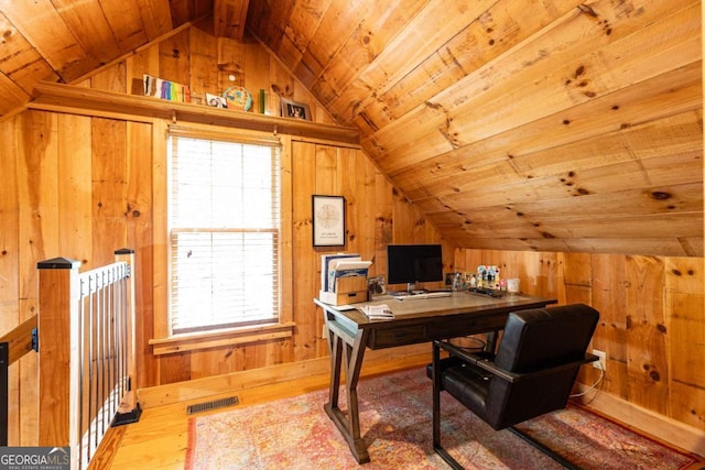 3380 Hill Forest Trl NW, Acworth, GA 30101 - home office featuring wood-type flooring, wood walls, vaulted ceiling, and visible vents