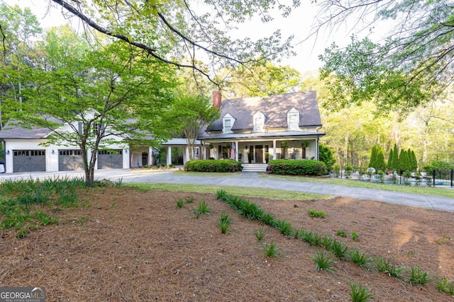 3380 Hill Forest Trl NW, Acworth, GA 30101 - cape cod house with a garage, curved driveway, a chimney, and a porch