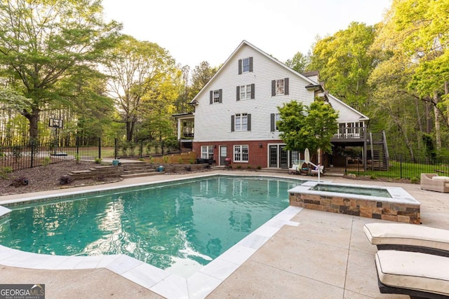 3380 Hill Forest Trl NW, Acworth, GA 30101 - view of pool with a pool with connected hot tub, a wooden deck, fence, a patio, and stairs