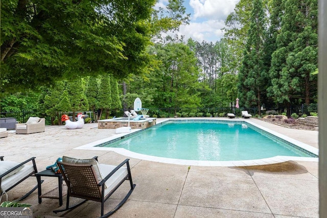 3380 Hill Forest Trl NW, Acworth, GA 30101 - view of pool with a patio, a pool with connected hot tub, fence, and an outdoor hangout area