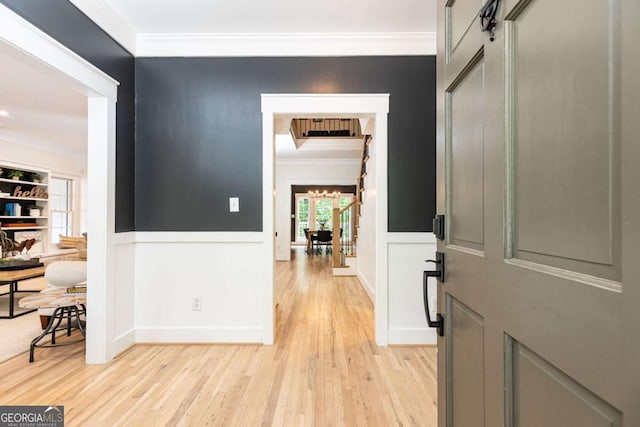 3380 Hill Forest Trl NW, Acworth, GA 30101 - entrance foyer featuring a decorative wall, wainscoting, ornamental molding, and light wood-style floors