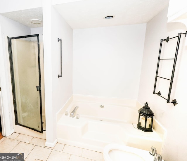 7415 Sierra Dr, Columbus, GA 31904 - bathroom featuring a garden tub, tile patterned flooring, and a shower stall